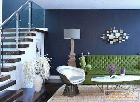 Green sofa and blue walls in the living room