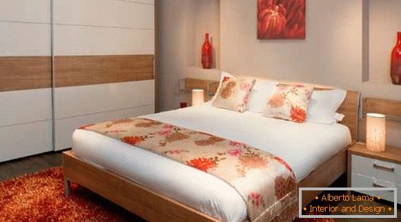 Modern bedroom design with a wardrobe compartment - interior photo