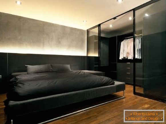 Built-in wardrobe system with coupe doors in bedroom design
