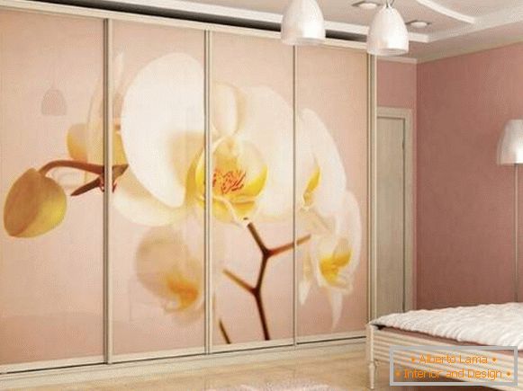 Delicate bedroom with wardrobe compartment with photo printing