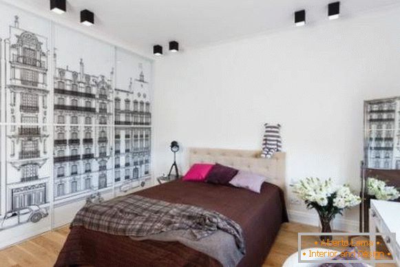 Bedroom design with a compartment wardrobe with a black and white pattern