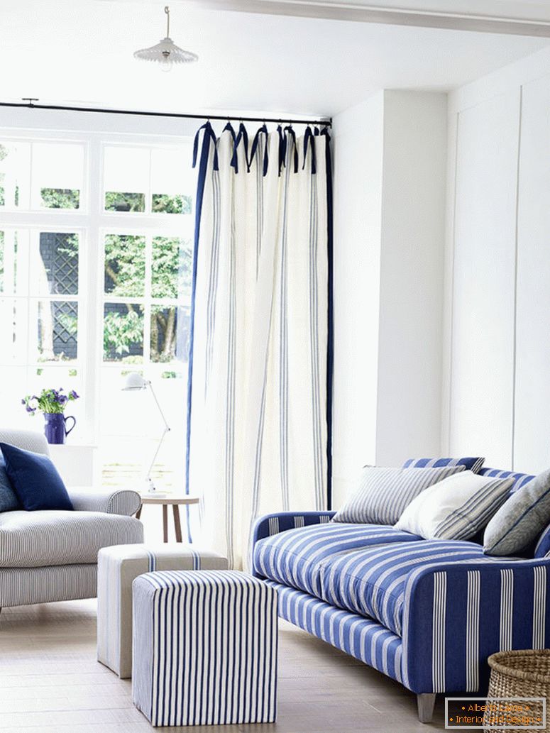 3-ian-mankin-blue-living-room-sofa-in-oxford-stripe-navy-armchair-in-ticking-navy-curtains-in-grain-stripe-indigo-lifestyle-portrait