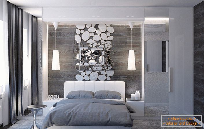 The wall above the head of the bed is decorated with a stylish collage of oval-shaped mirrors.