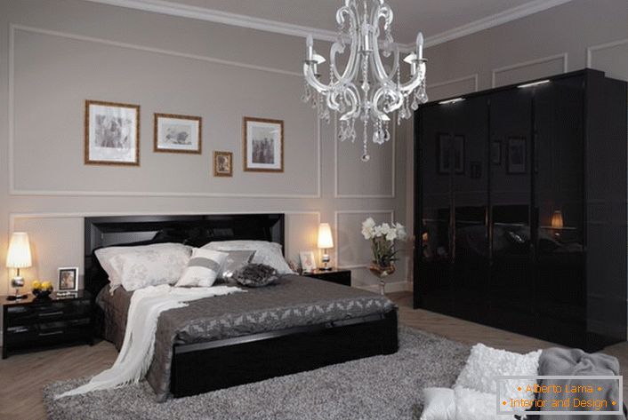 A cozy and stylish bedroom in high-tech style, made in light gray tones, with contrasting black furniture.