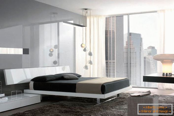 Glossy surfaces with a metallic luster make the hi-tech bedroom more spacious and light.