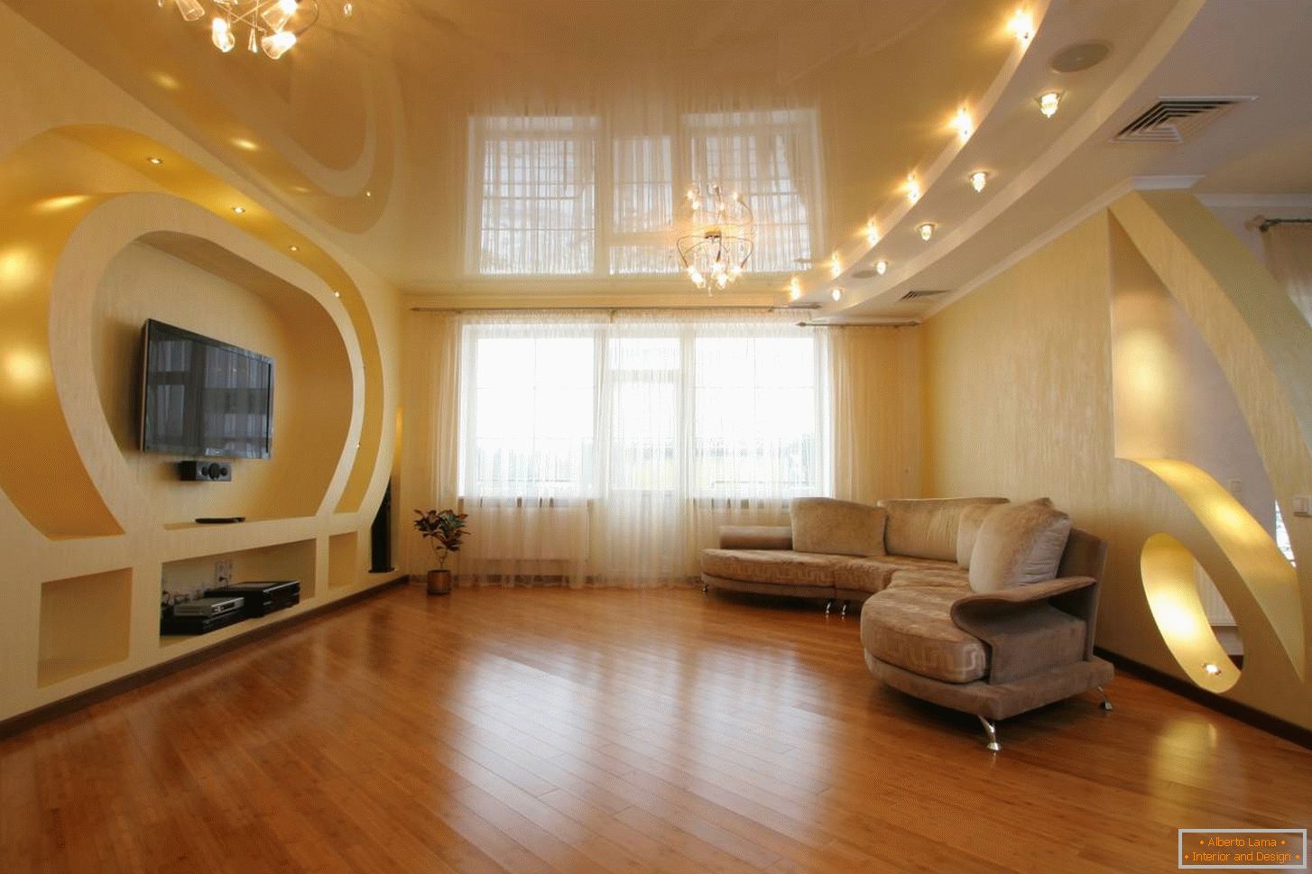 The gentle peach ceiling in the color of the general interior decoration is equipped with lighting, divided into zones. LED lights above the sofa and two chandeliers on either side of the room.