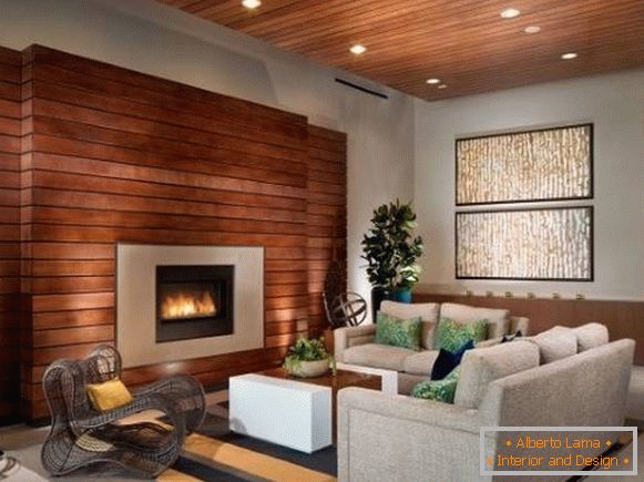 Decorative wall decoration with wood - boards on the wall with a fireplace