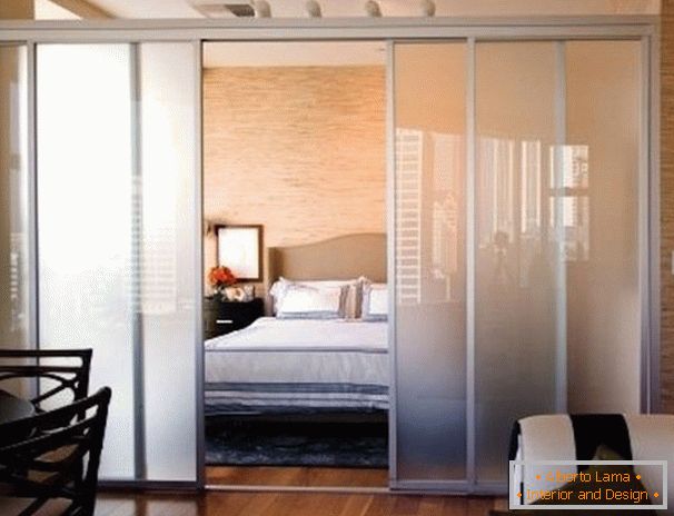 Glass partition in the bedroom of the living room