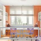 Orange curtains in a light interior