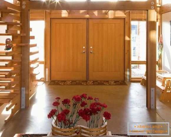 Double-leaf entrance doors in light wood