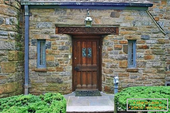 Design of a house and doors under a medieval castle