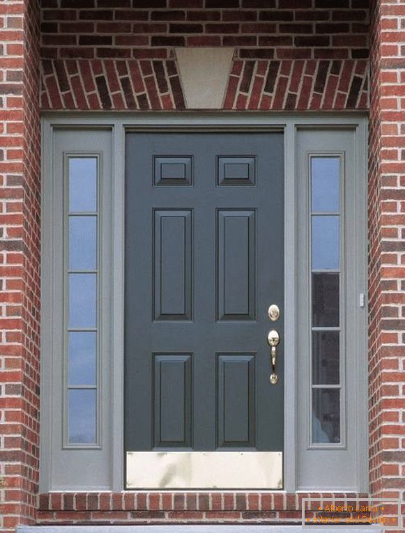 Entrance doors to a red brick house