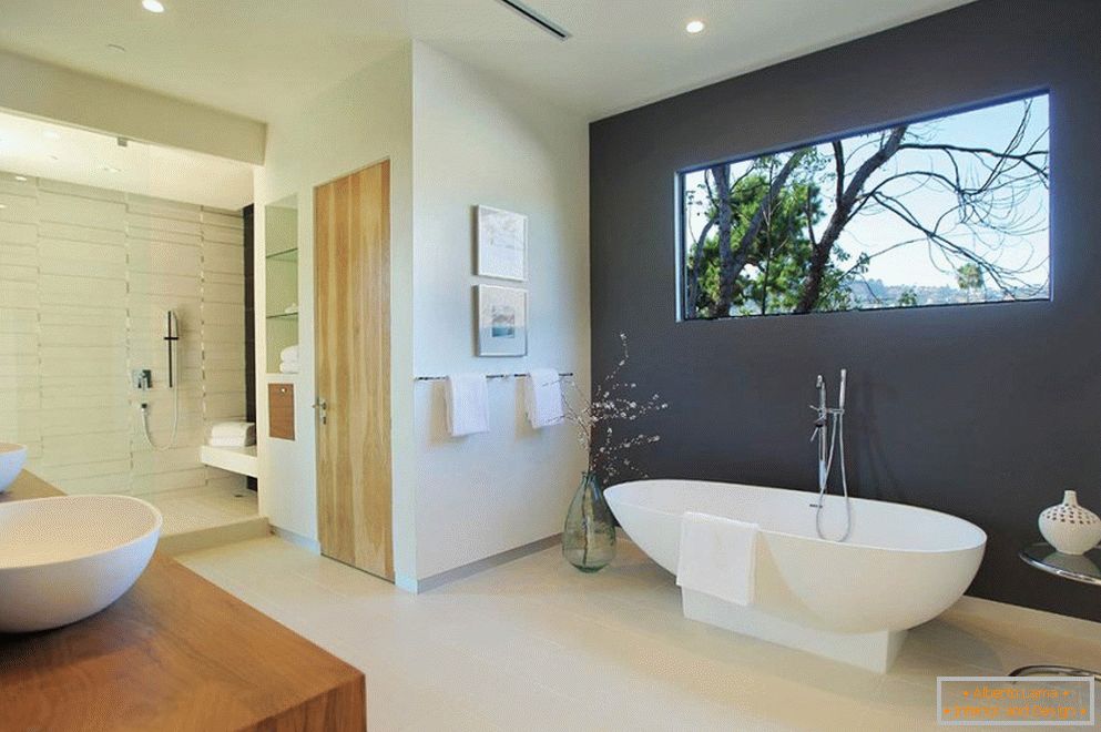 Gray wall in a light bathroom interior