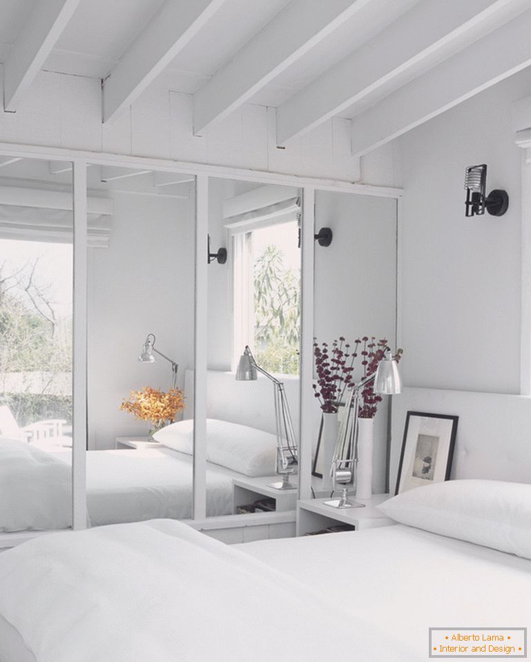 Mirror in the modern interior of the white bedroom