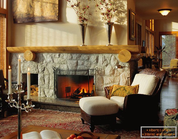 A cozy, family-run guest room in country style with a fireplace made of natural stone.