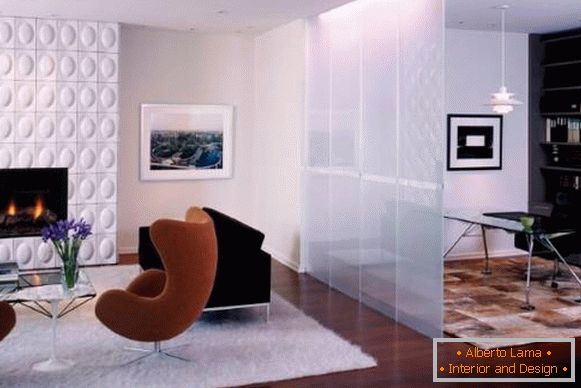 The glass partition in the apartment studio - living room and office