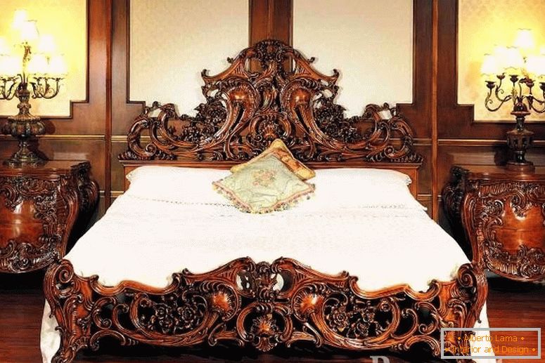 Wooden bedside tables and a bed with carved patterns