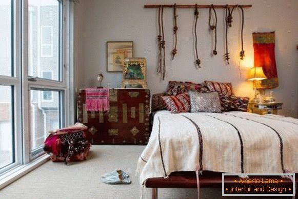 Bohemian style in the interior of the bedroom in the apartment