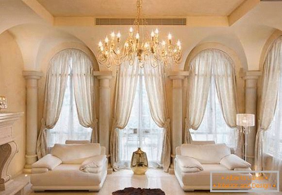 Arched windows and tulle curtains photo