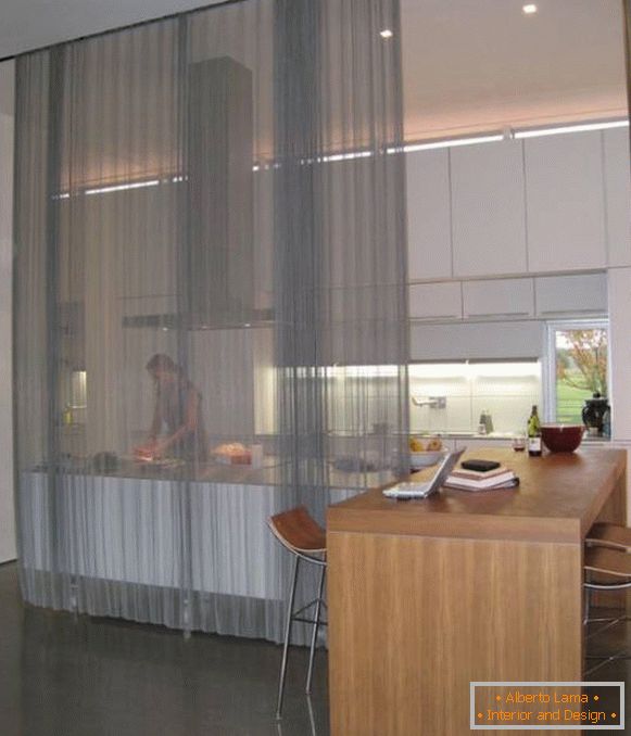 Transparent curtains in the interior of the kitchen photo