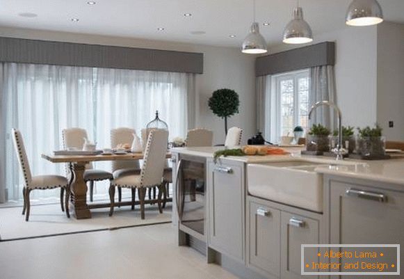 Transparent tulle curtains in the design of the dining area in the house
