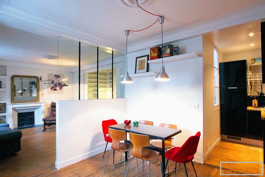 Dining room behind a partition in a small studio apartment in Paris