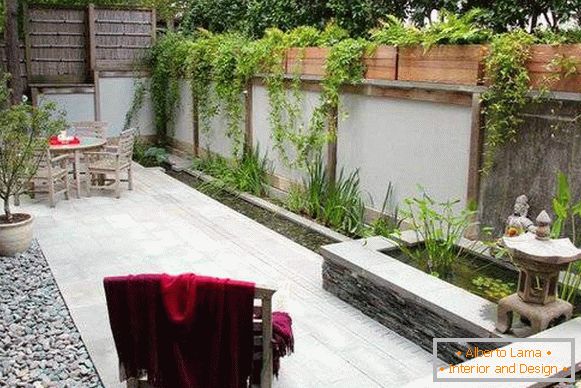 Fencing of a terrace with a high fence - photo