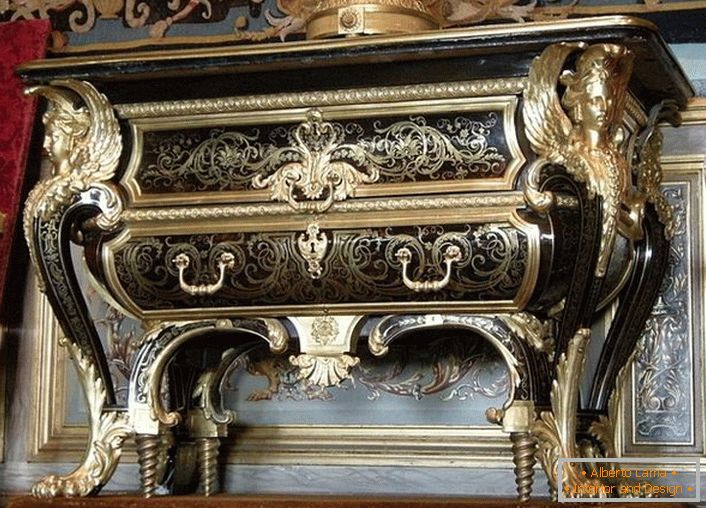 Exquisite coffee table with gold elements. Furniture in the house of a prosperous Frenchman. 