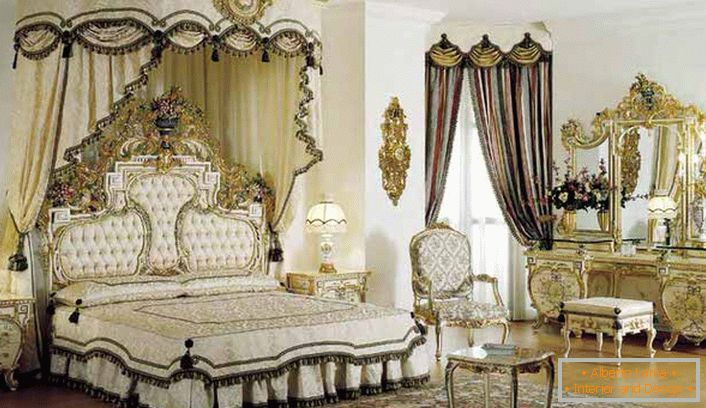 In the center of the composition is a four-poster bed. In accordance with the style of baroque in the room is a massive dressing table with gold finish.