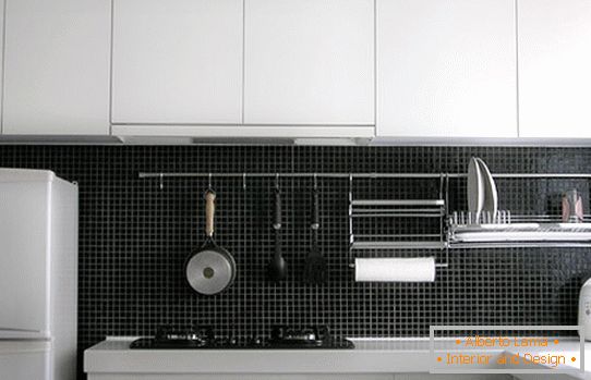 Metal construction with hooks for kitchen utensils