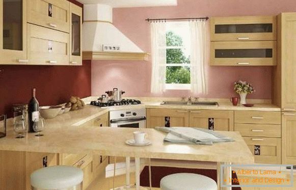 The interior of the corner kitchen with a bar counter - a photo in beige and pink tones