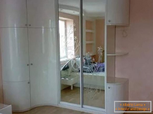 Corner cabinet with swinging doors and compartment in the bedroom - photo