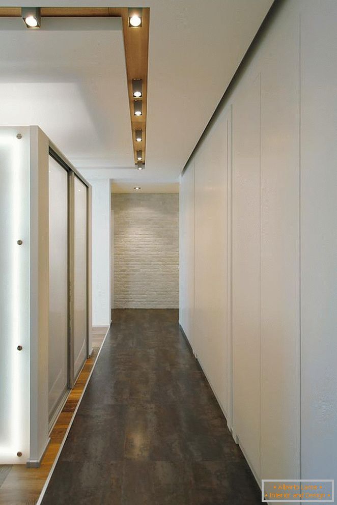 Corridor, decorated in white and gray tones with elements of wood