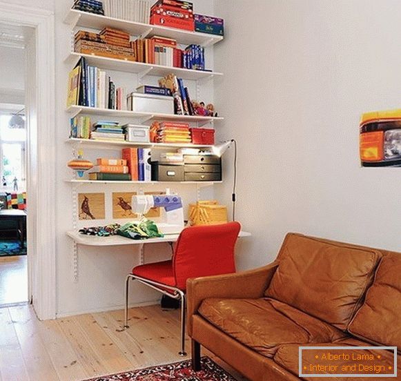 Book shelves above the desk