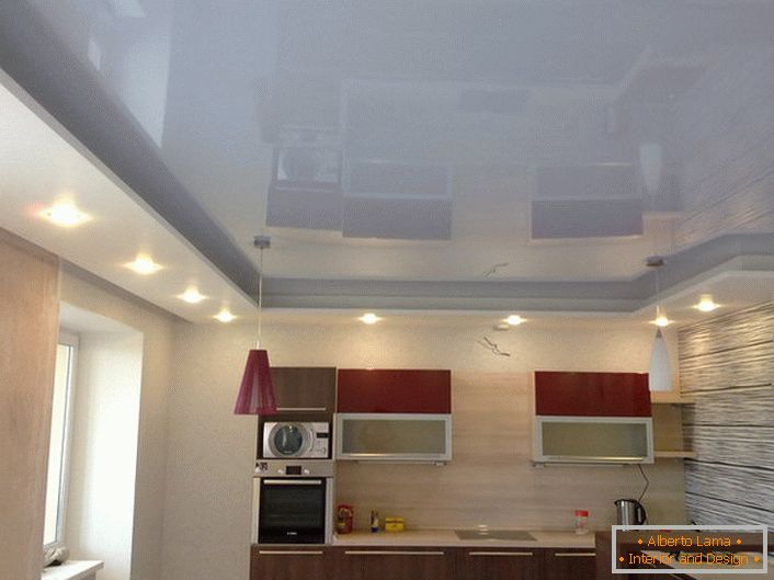 A two-level stretch ceiling with a layout around the perimeter of the room is a new trendy trend.