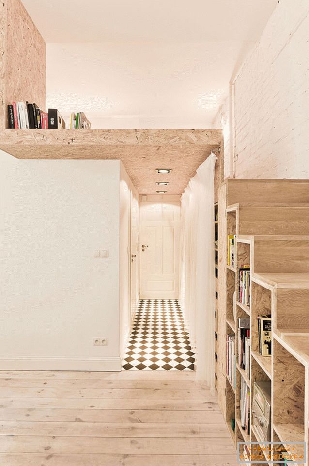 Bedroom on the second level of a two-storey studio apartment in Poland