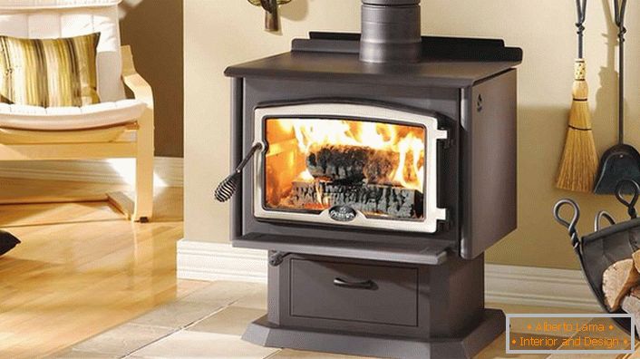 Modern cast-iron fireplace with refractory glass-the ability to enjoy live fire and safety.
