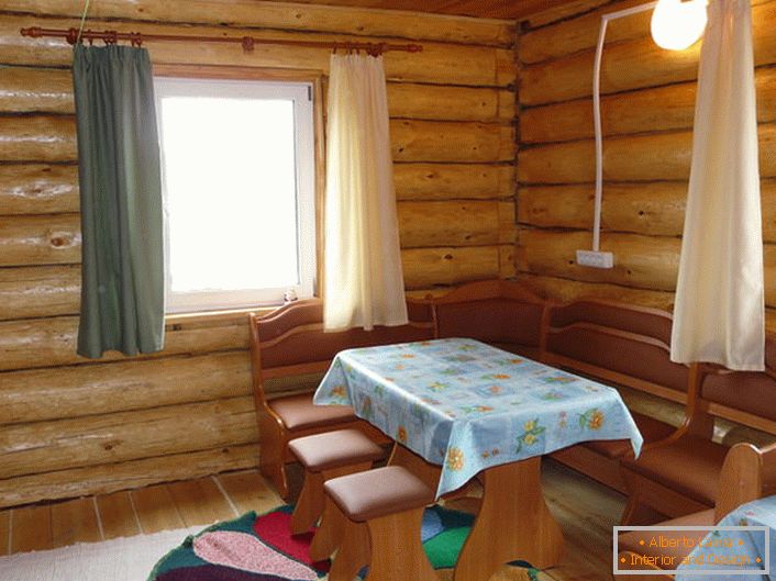 A spacious rest room in the house with a bath. At this table can accommodate a large company or a friendly family, and at night a warm room can turn into a bedroom for guests.