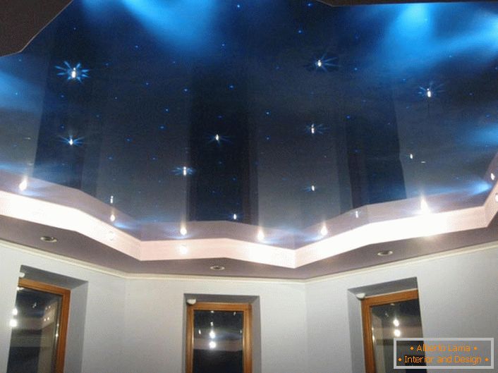Stretch ceiling with imitation of the starry sky - a creative design solution for the design of a bedroom or a children's room.