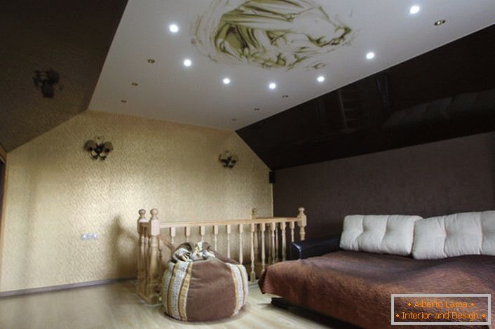 The living room on the second floor of the country house is decorated with stretch ceilings with photo printing.