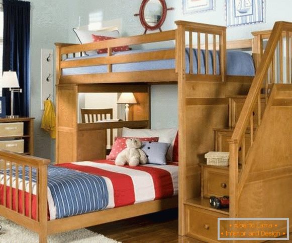 Baby bed with drawers on the photo