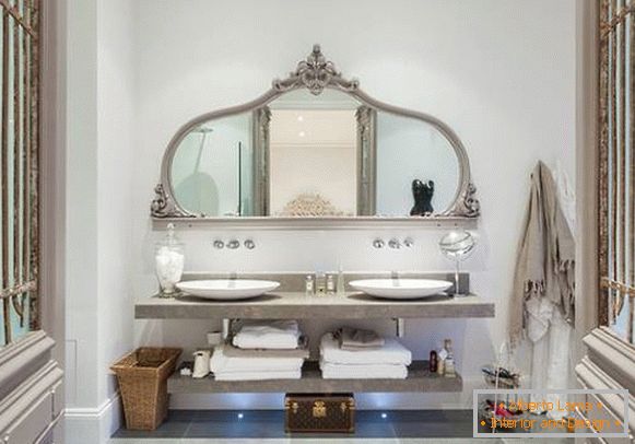 Elegant large mirror with shelves in the bathroom