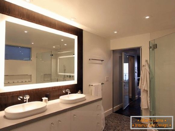 Rectangular mirror with illumination in the bathroom