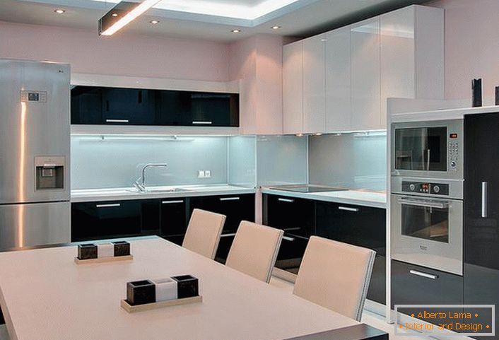 Attractive glossy surface finish of the kitchen set in the minimalist style makes the situation modern and memorable.