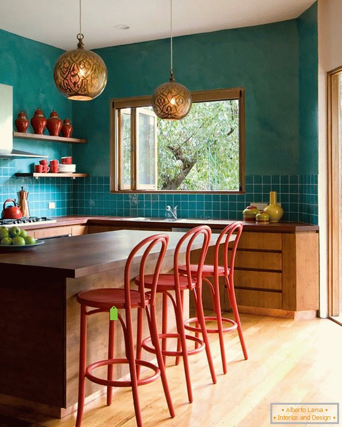Turquoise wall decoration in the kitchen makes the room more spacious. Laconic, modest furniture fits seamlessly into the overall interior in the style of eclecticism.