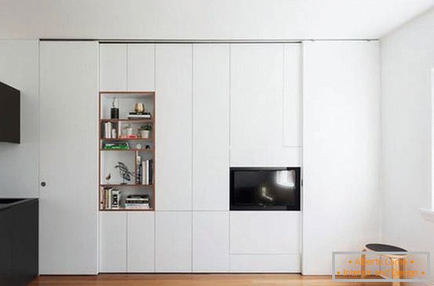 Modular wall in the interior of the apartment also divides the space