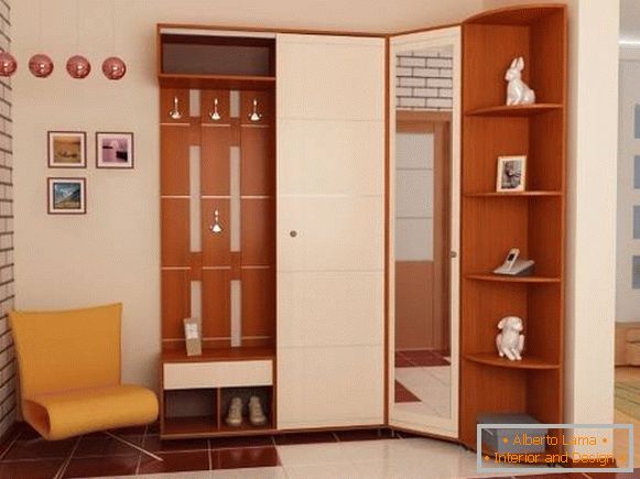 A beautiful corner wardrobe in the hallway with a mirror on the door