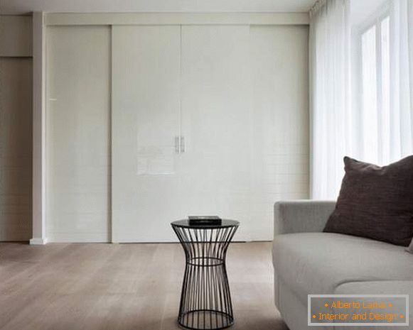 Built-in wardrobes to order - white wardrobe in the living room