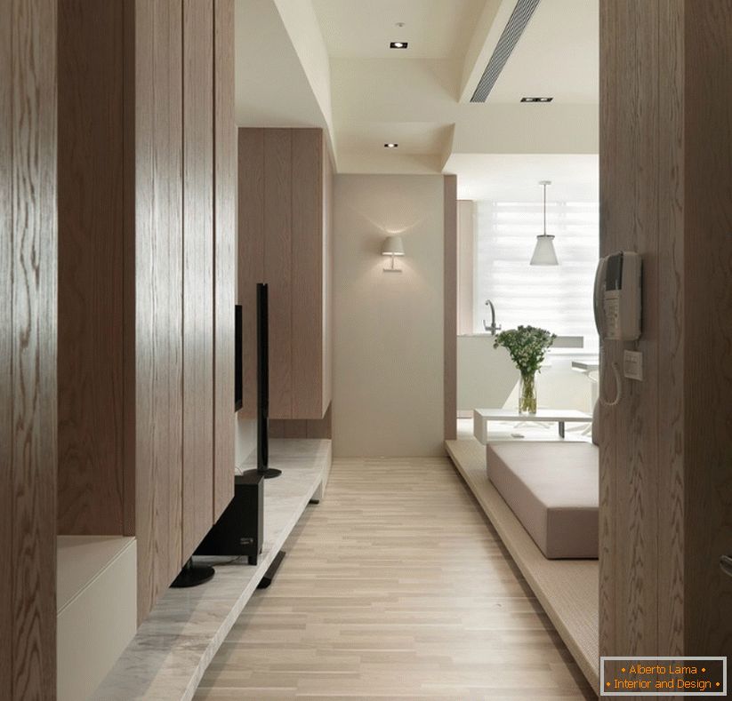 Wooden cabinets in the interior of a small one-room apartment