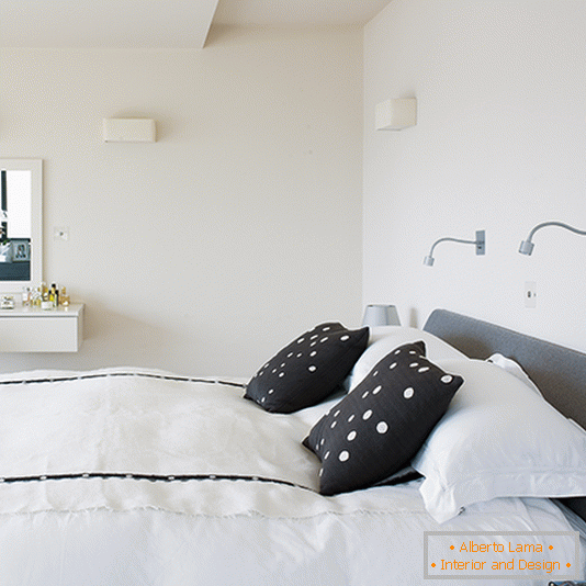 Monochrome bedroom with minimalistic wall lights